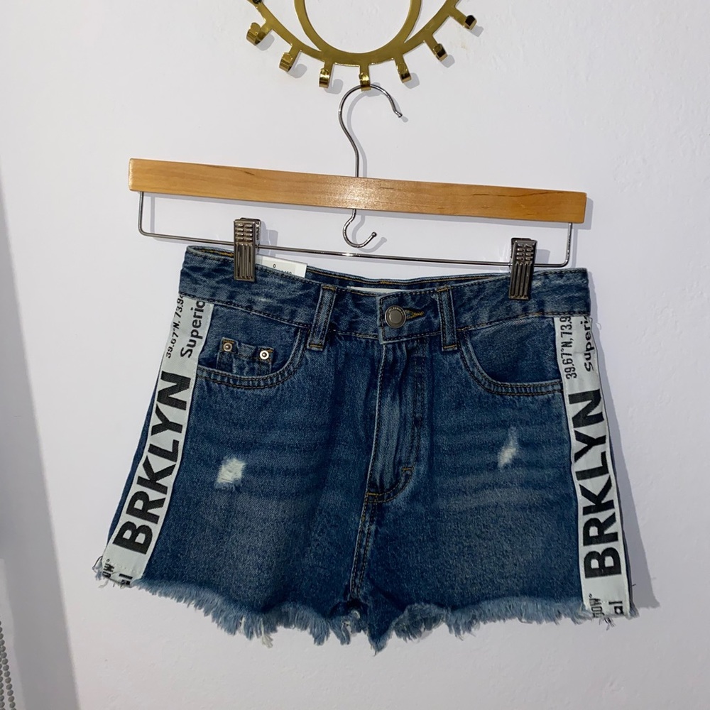 Denim shorts with wording along the sides